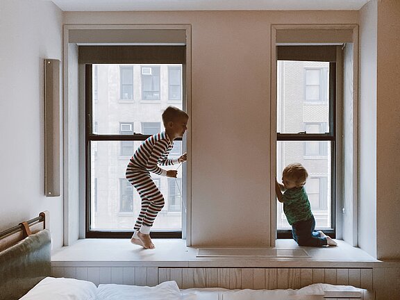 two-kids-playing-beside-glass-windows-3273851.jpg  